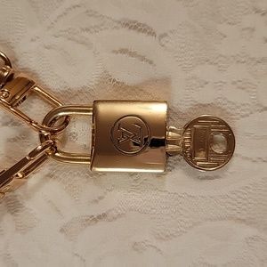 Vintage Louis Vuitton lock and key with unbranded chain